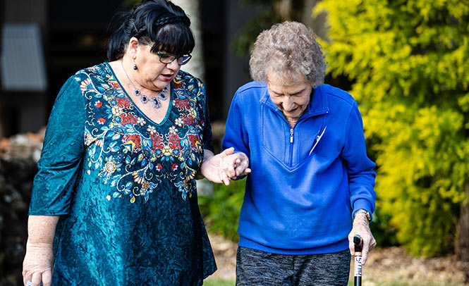 Elderly lady and her carer