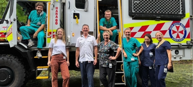 Various clinical staff standing by a NSW Ambulance