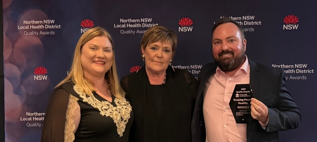 Photo of 3 people, winners of the award for Excellence in Keeping People healthy