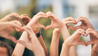 photo of hand hearts